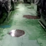 Piso verde danificado com ralo antes da reforma