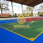 Quadra em pintura acrílica com logo Superpox e área azul